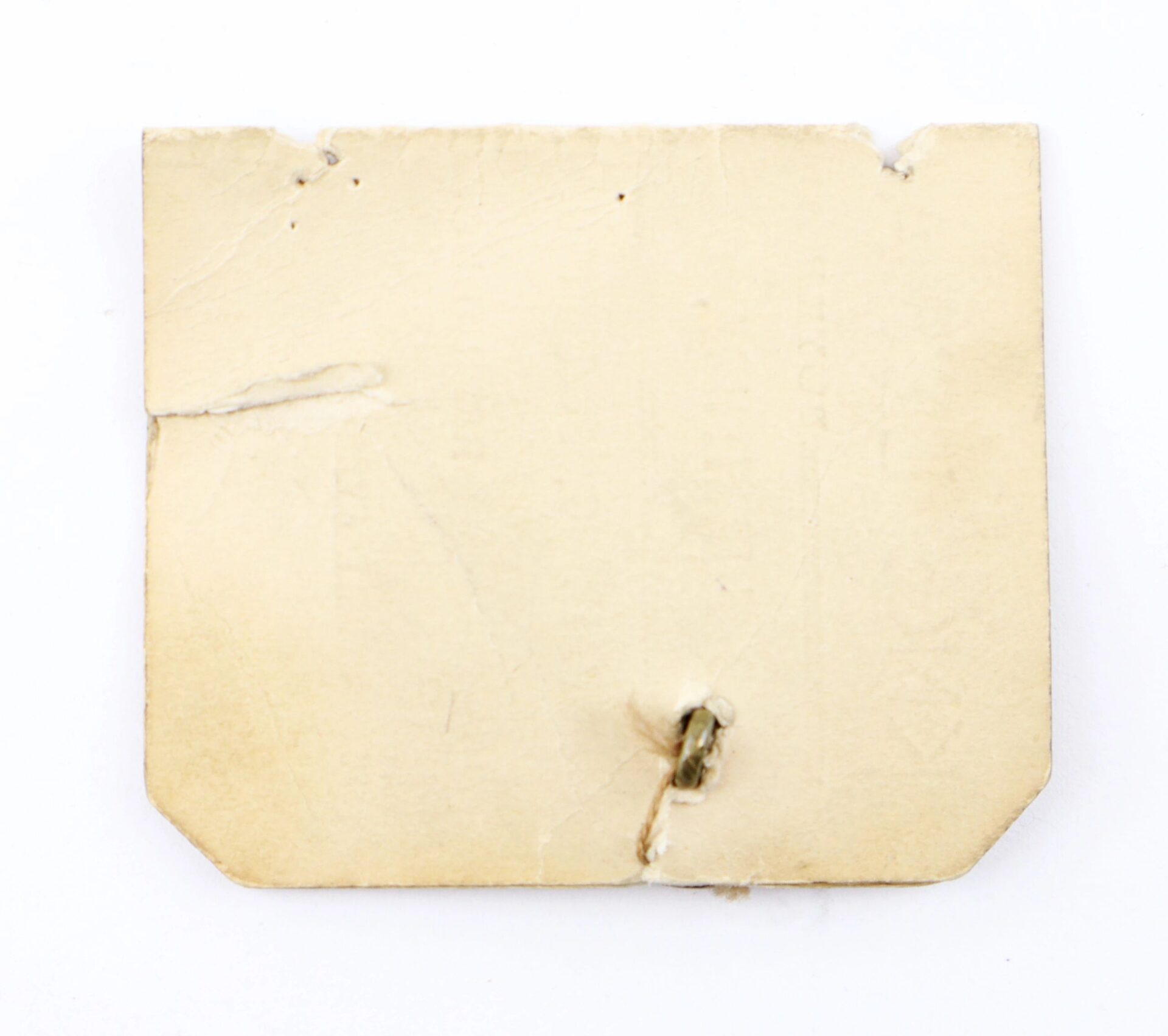 A square piece of aged, torn beige paper with a hole and staple near the bottom center displays the Button Worn by President John Adams, shown against a white background.