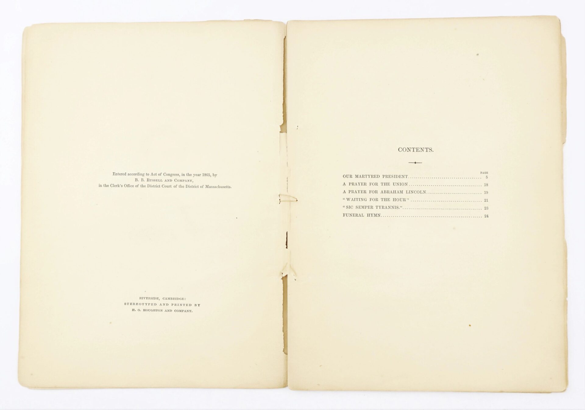 An open book of "1865 Our Martyred President by Phoebe Anne Hanaford / SOLD" displays the copyright page on the left and a table of contents with titles and page numbers on the right.