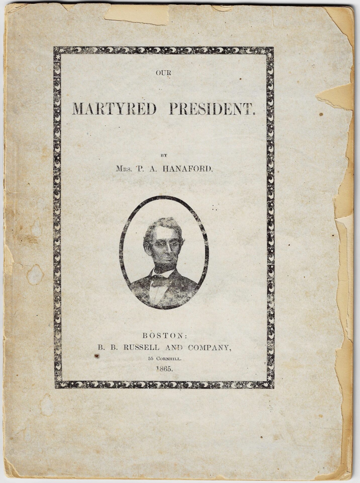A worn 1865 book titled "Our Martyred President" by Phoebe Anne Hanaford, featuring Abraham Lincoln on the cover. Marked SOLD.