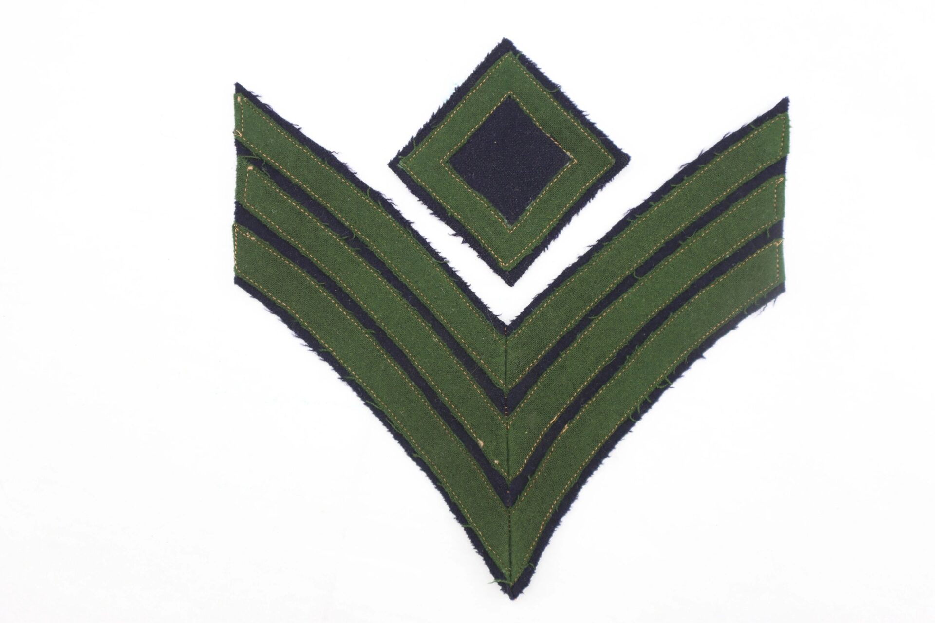 A Civil War Rifleman/Sharpshooter insignia patch featuring two green chevrons beneath a green diamond on a black background.