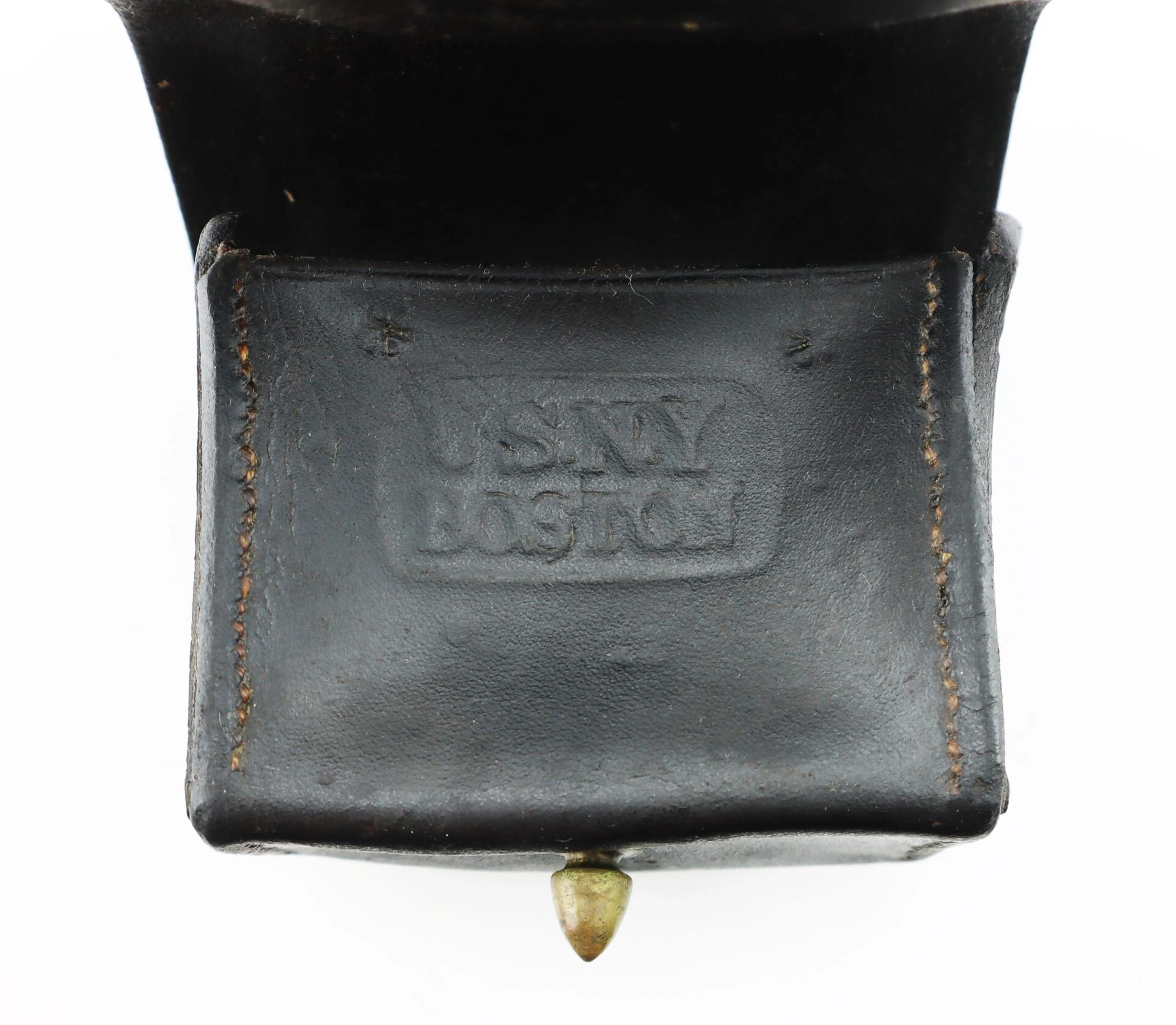 Close-up of a Civil War Navy Fuse Box, a black leather pouch with visible stitching and "USNY Boston" embossed on the front flap.