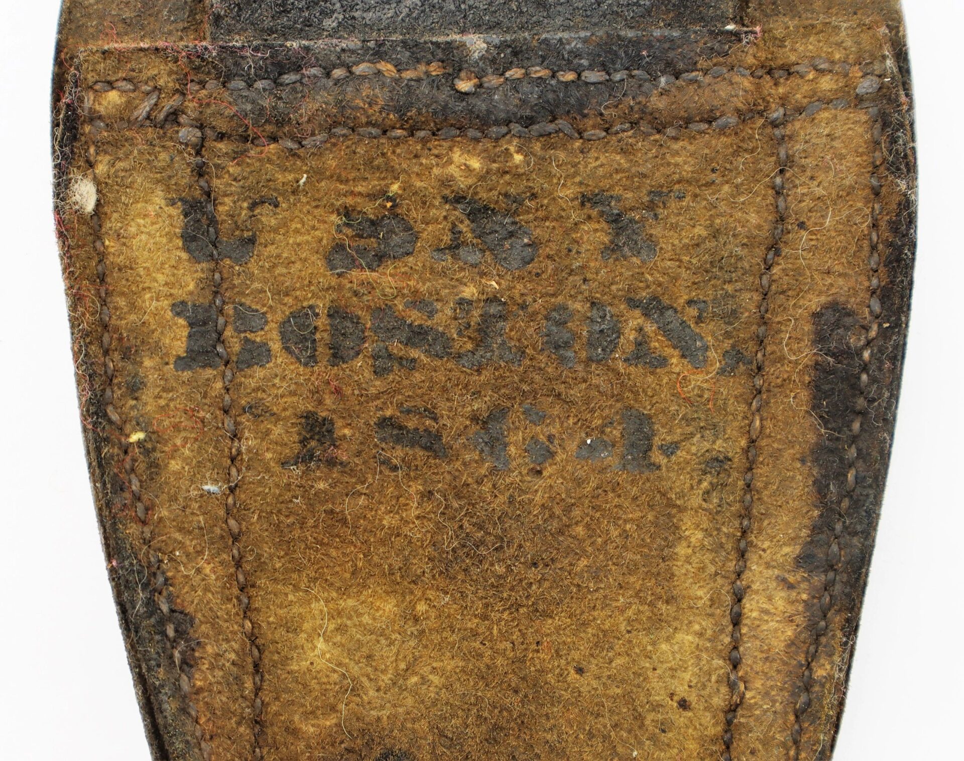 Close-up of the Civil War Boston Navy Yard Cutlass Frog, showing worn brown leather with black stenciled "U.S. NAVY BOSTON 1864," visible stitching, and aged texture. This item is SOLD.