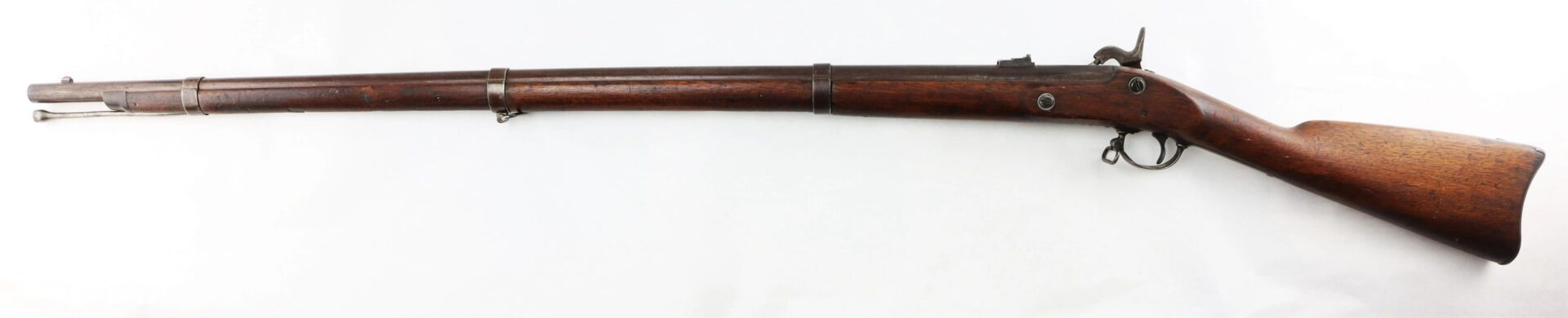 A Confederate “Captured and Collected” Model 1861 Springfield Rifle-Musket with a vintage wooden stock, long barrel, metal fittings, and exposed hammer is displayed on a white background.