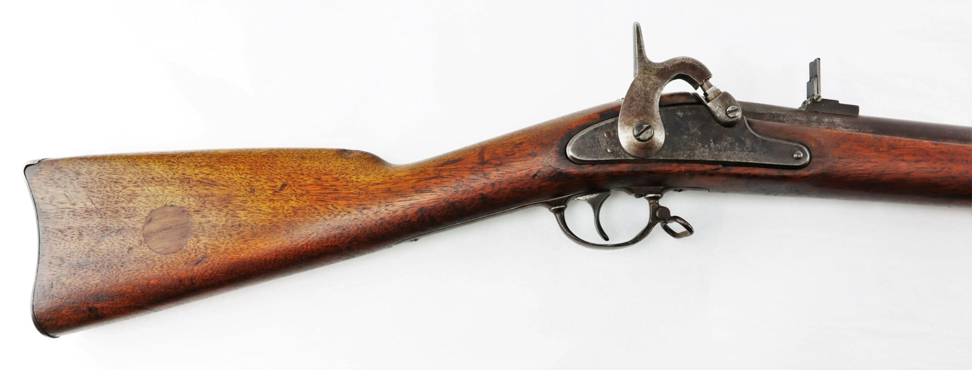 Side view of a Confederate “Captured and Collected” Model 1861 Springfield Rifle-Musket, featuring antique wooden stock and metal firing mechanism, isolated on a white background.