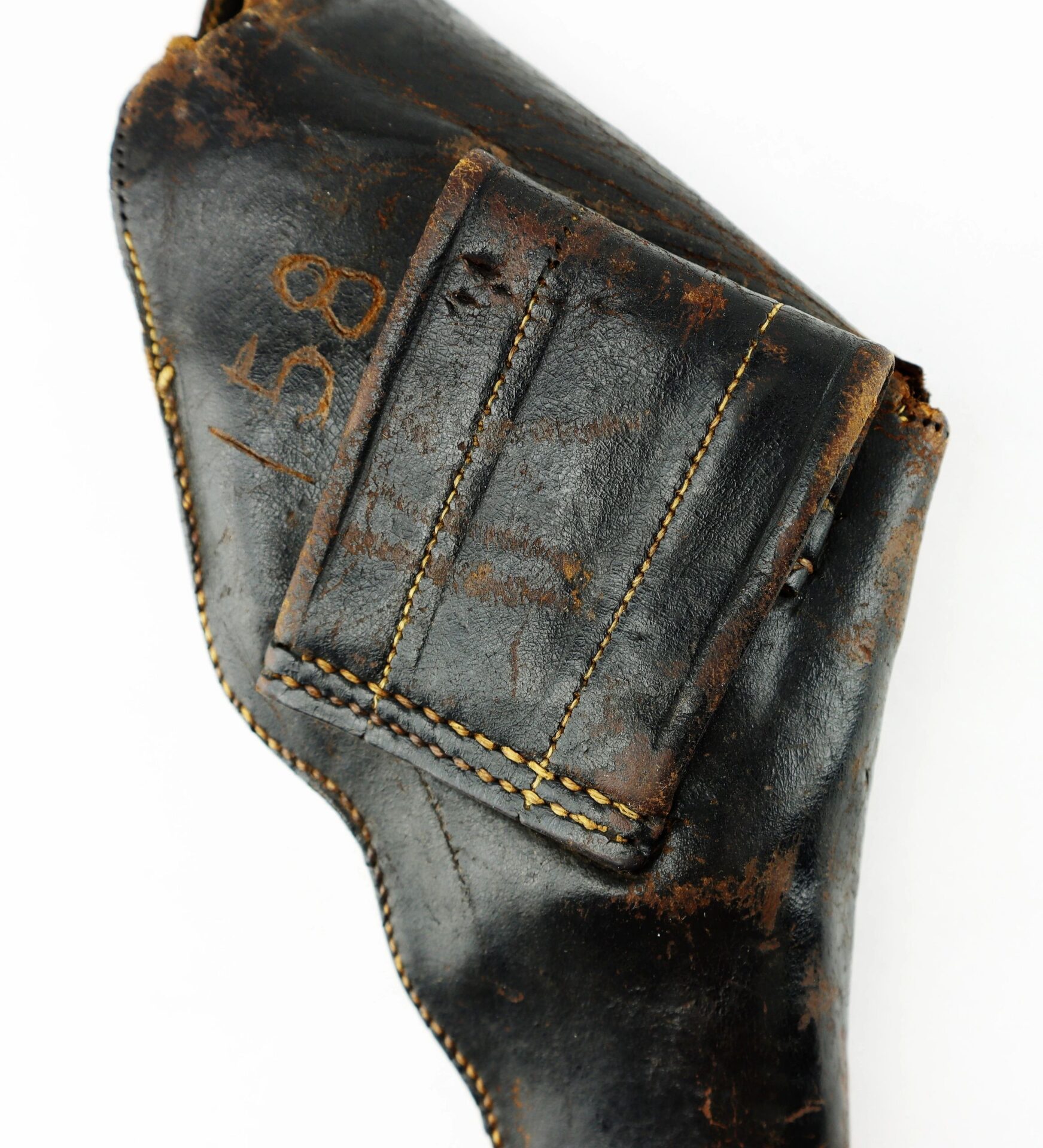 A worn Civil War Era Revolver Holster made of black leather features visible stitching and faded "158" numbers marked on its surface.