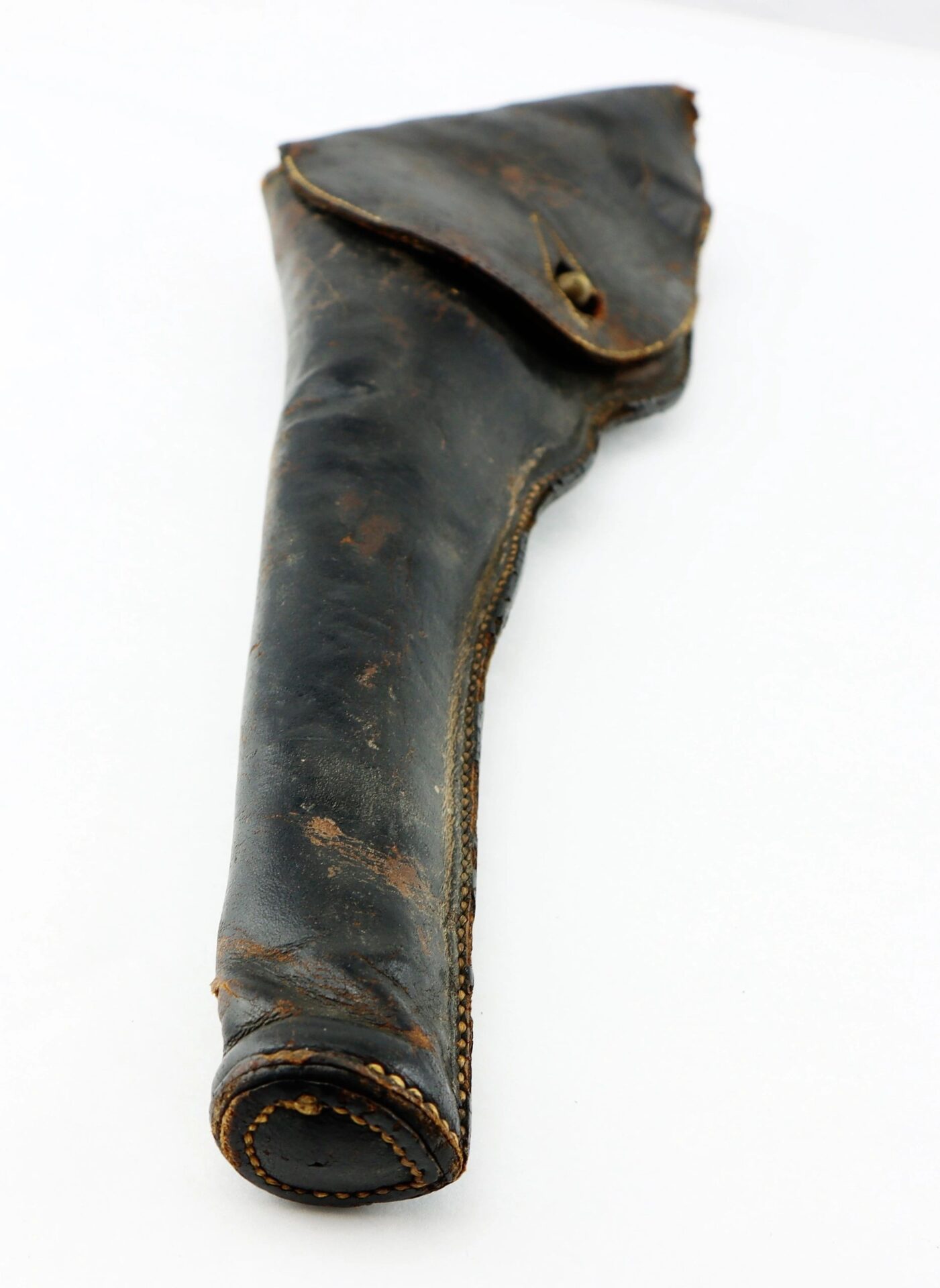 A Civil War Era Revolver Holster made of worn dark leather with visible stitching and a buttoned flap, displayed on a white background.