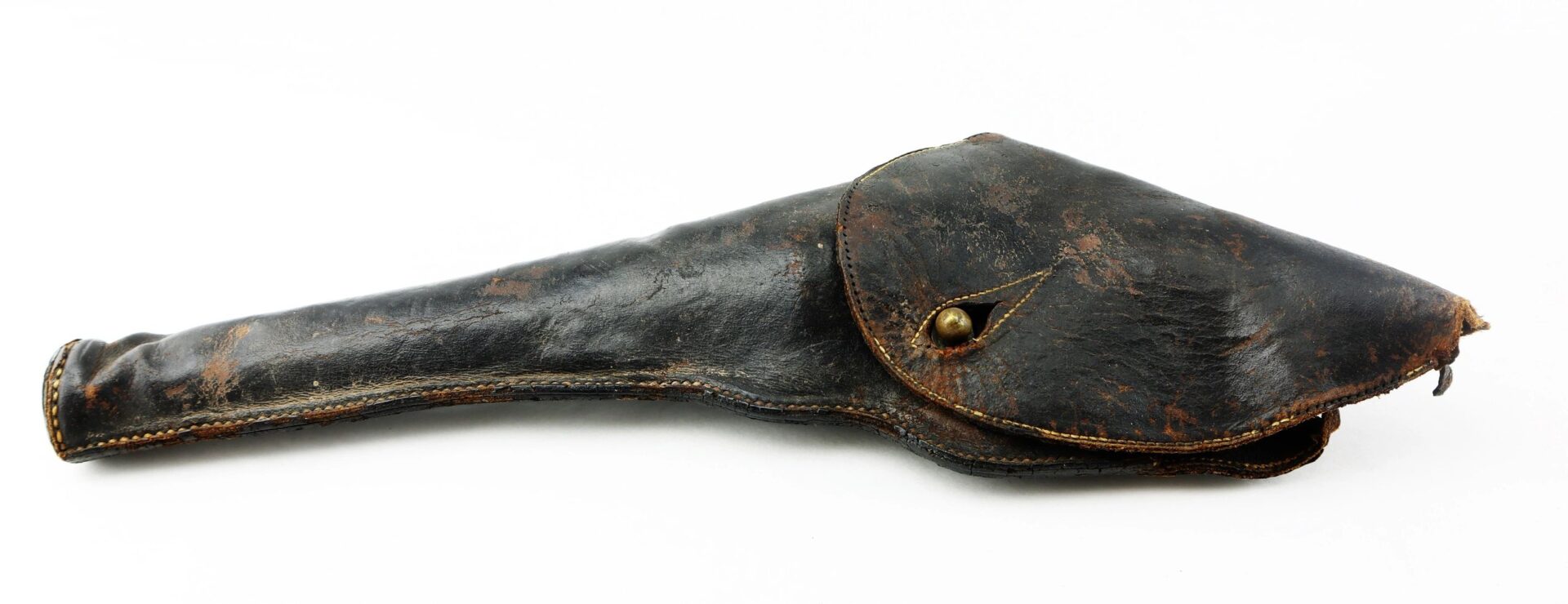 A Civil War Era Revolver Holster, made of worn black leather with a flap closure and brass button, shows signs of age and use. Displayed on a white background.