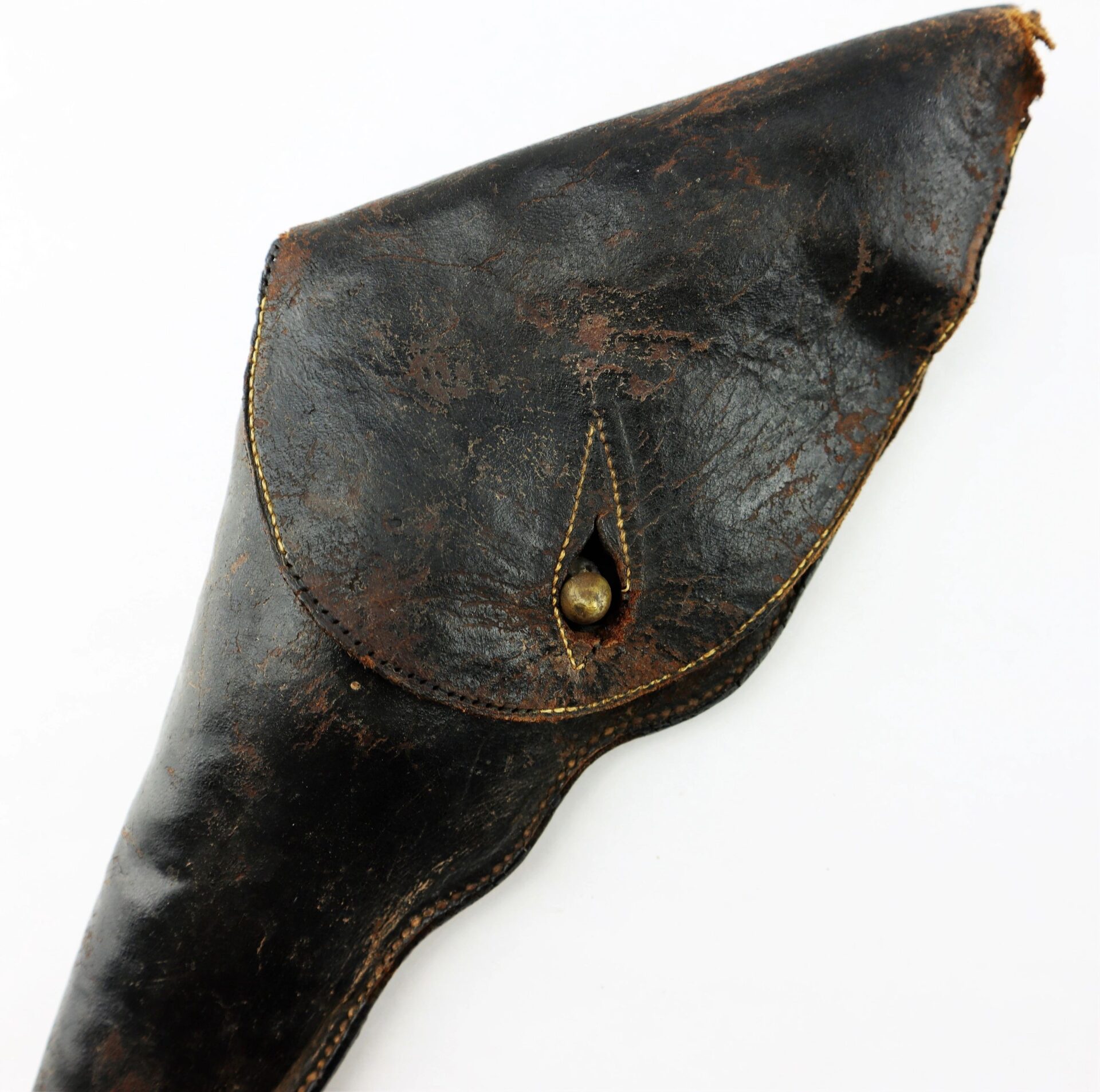 The Civil War Era Revolver Holster is a worn, dark brown leather holster with a flap closure and visible stitching, showing signs of age and use.