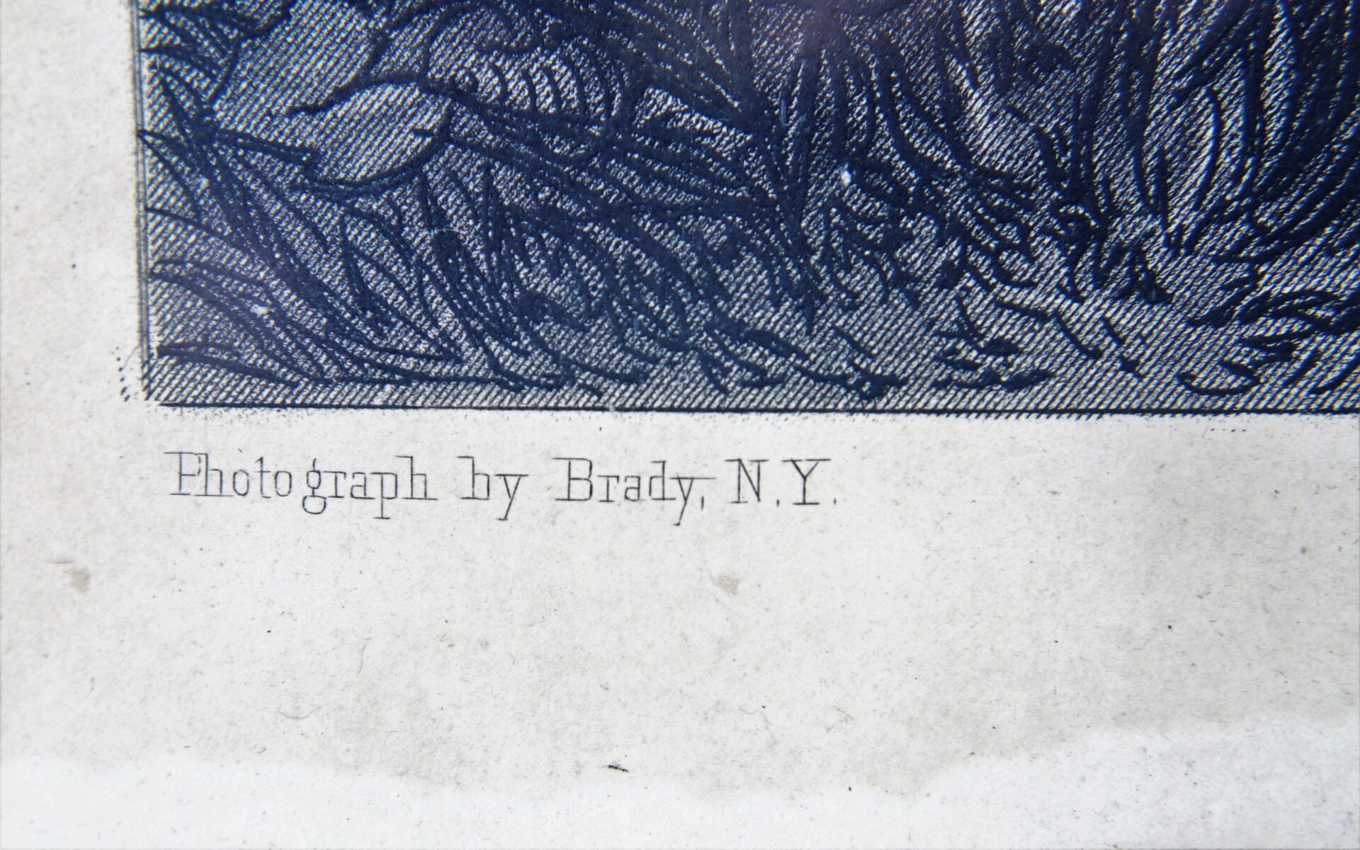 Close-up of printed text on paper reading "Photograph by Brady, N.Y." below a partial dark-toned illustration for General Robert E. Lee / SOLD.
