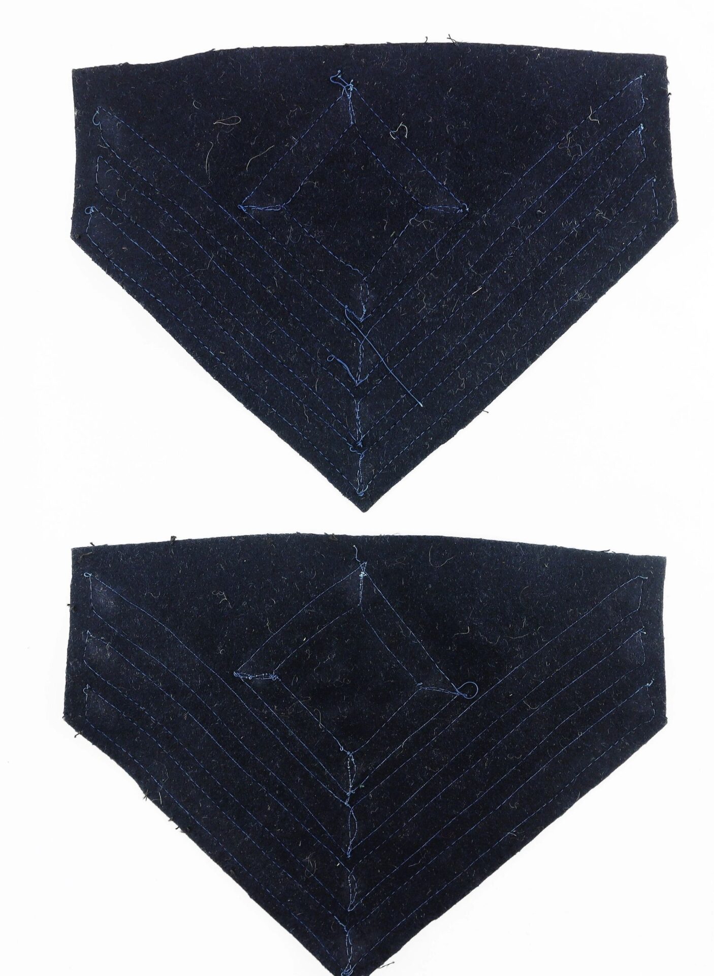 Two dark blue First Sergeant of Infantry Chevron fabric patches with stitched geometric patterns, arranged vertically on a white background.