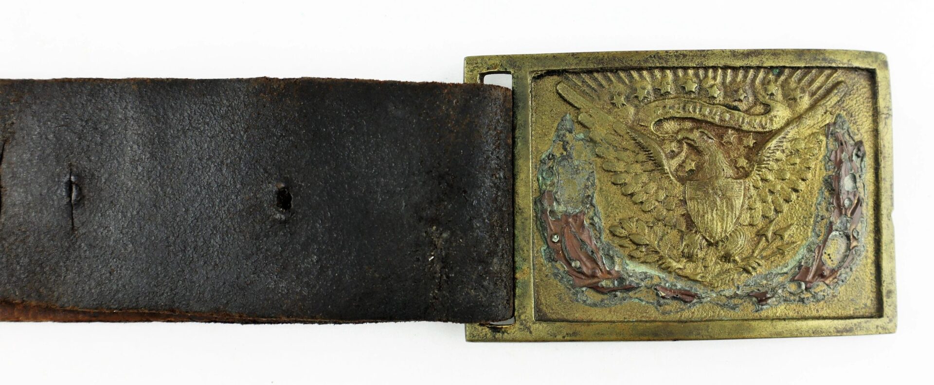 A vintage U.S. Foot Artillery Belt with a worn leather strap and an old brass buckle embossed with an eagle and shield emblem.