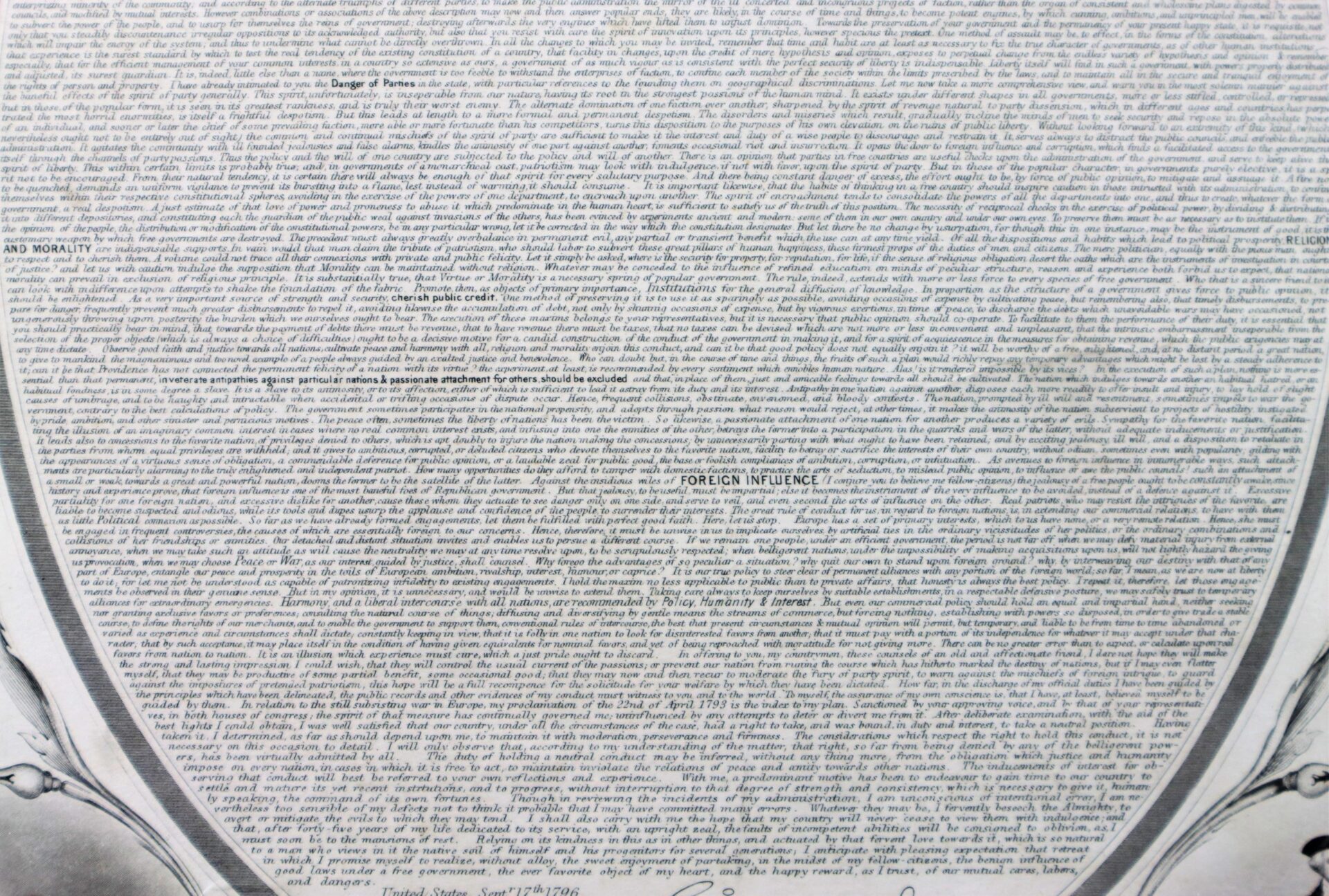 Close-up of "Washington’s Farewell," a densely printed page with small, tightly packed text, section headings like “FOREIGN INFLUENCE” and “AND MORALITY,” and a decorative border.
