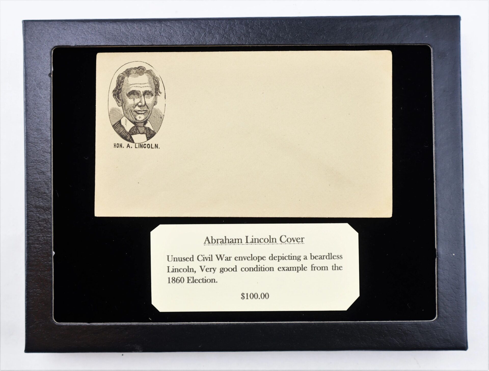 Abraham Lincoln Cover / SOLD: Unused envelope in display, showing a beardless Lincoln, labeled as Civil War-era 1860 Election item. Price: $100.