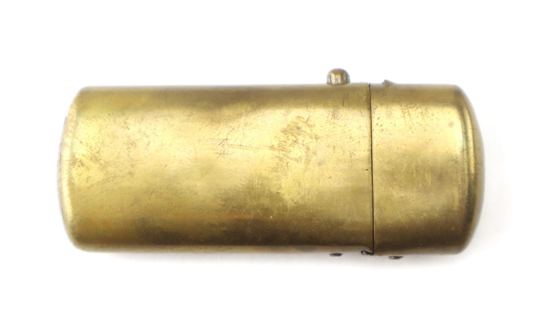 A Civil War Era Patriotic Match Safe made of vintage brass with a cylindrical shape and hinged lid, shown closed on a white background.