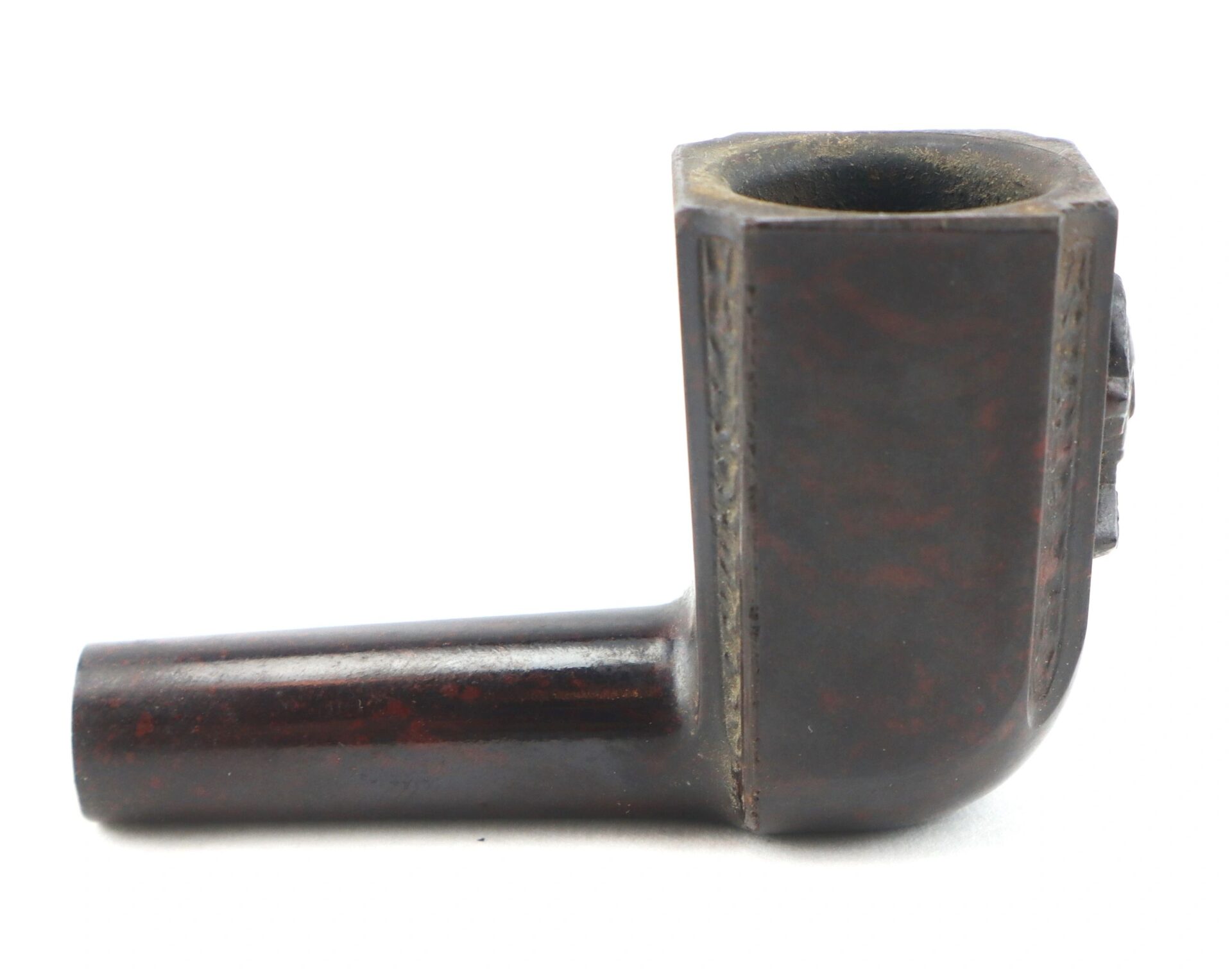 The General George Washington Gutta-Percha Pipe, circa 1850, is a dark brown, L-shaped pipe with a square bowl and plain stem, shown against a white background.