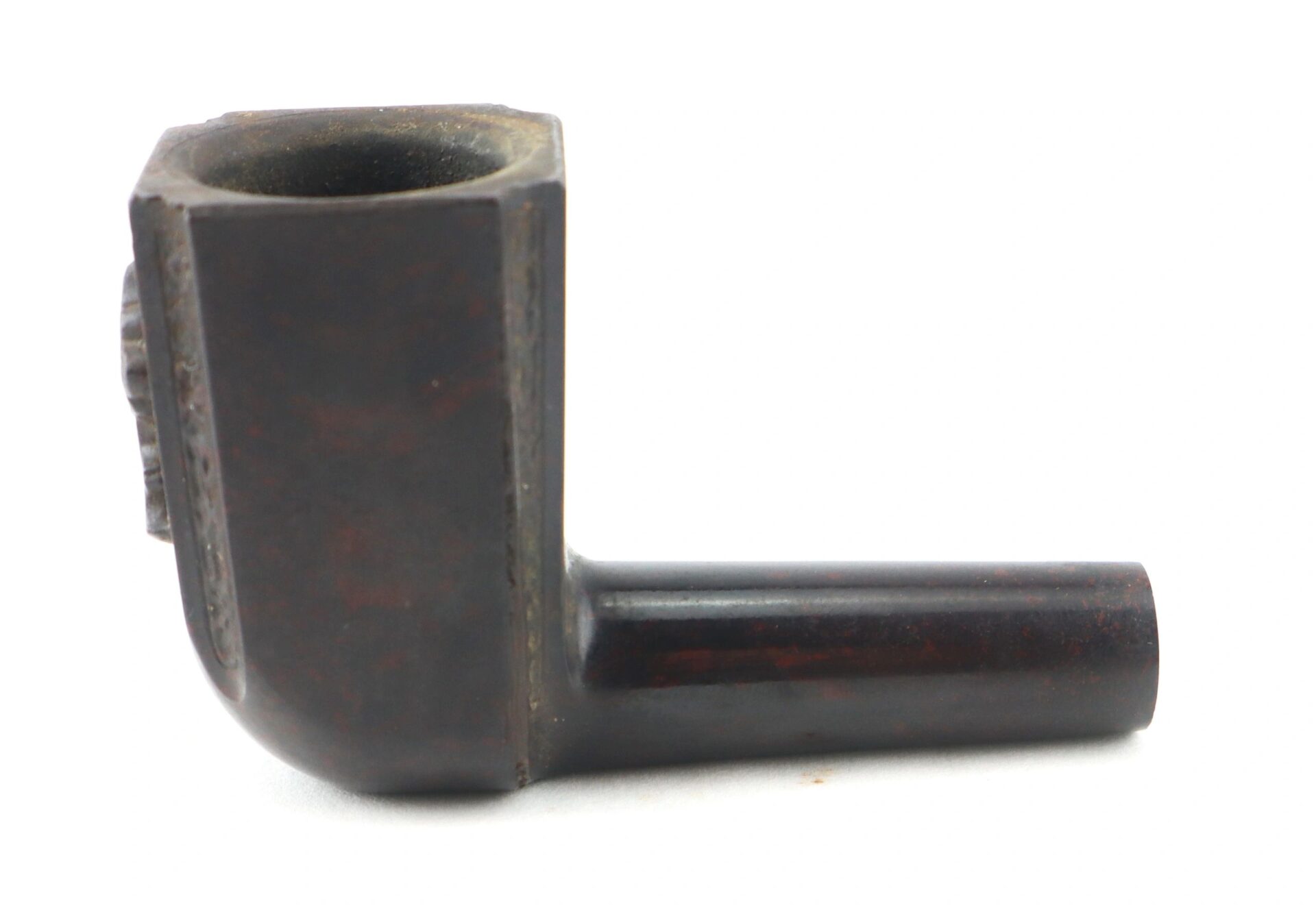 The General George Washington Gutta-Percha Pipe (ca. 1850) features a dark rectangular bowl and cylindrical stem, photographed against a white background.