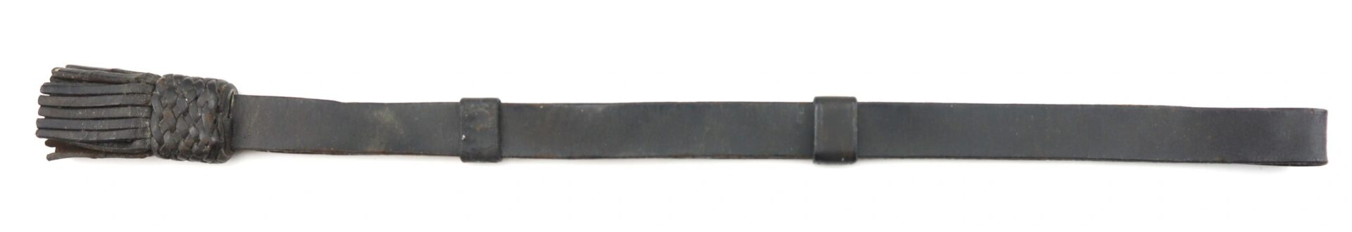 The Civil War Saber Knot / SOLD features a single dark leather strap with a woven handle and multiple thin fringe pieces at one end, displayed flat on a white background.
