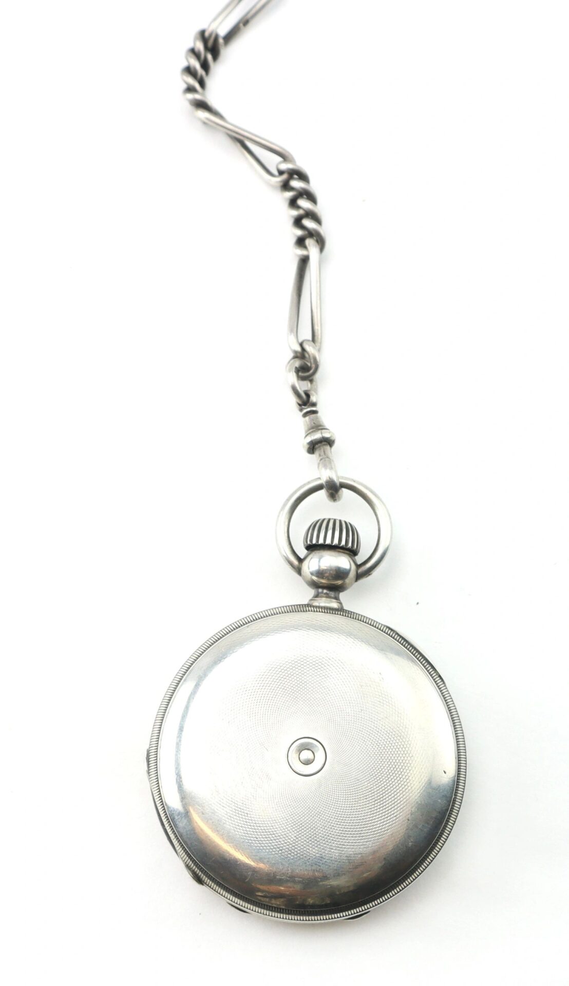 The Silver Presentation “Life Saving” Watch, a closed pocket watch with an attached chain, is photographed on a white background.