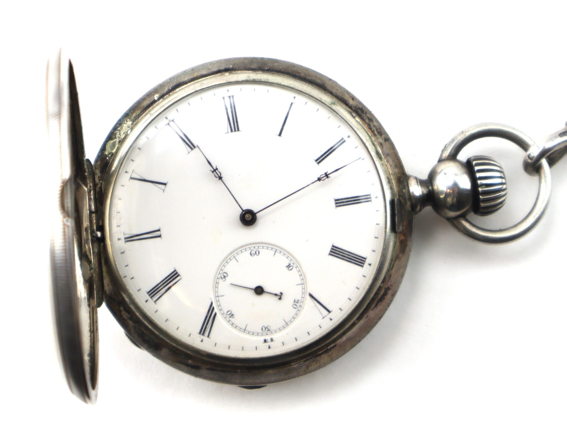 The Silver Presentation “Life Saving” Watch is an antique pocket watch featuring Roman numerals, a white face, black hands, a chain loop, and a small seconds subdial at the bottom.