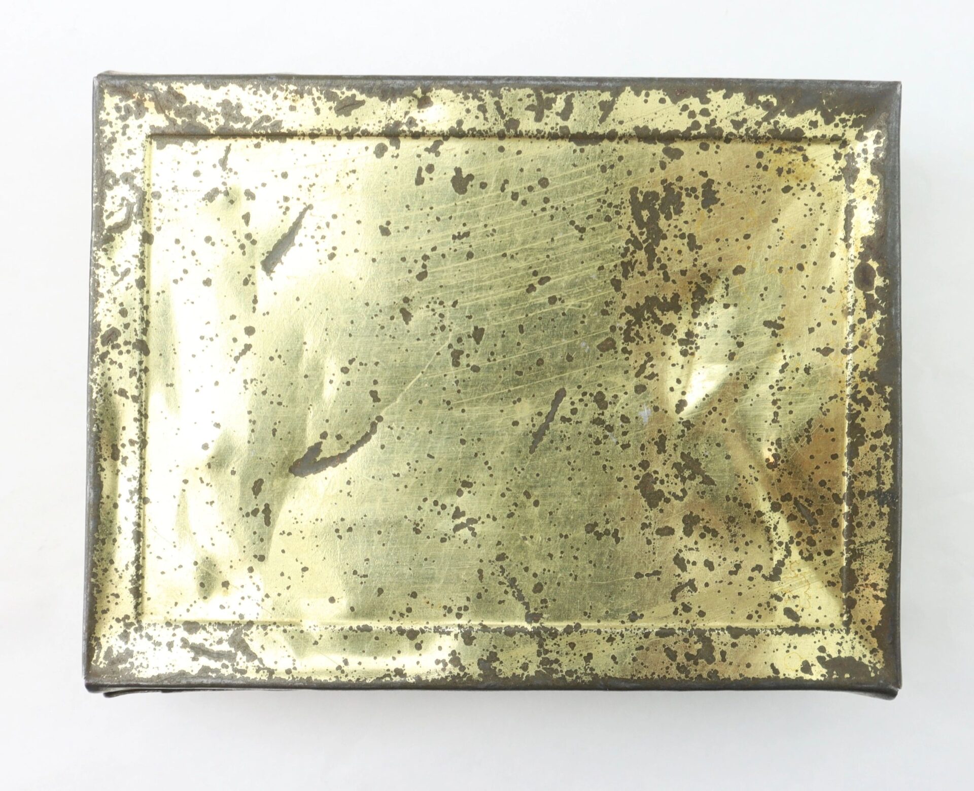 Important Libby Prison Relic, a rectangular metal box with a tarnished and spotted brass lid, viewed from above against a white background. / SOLD.