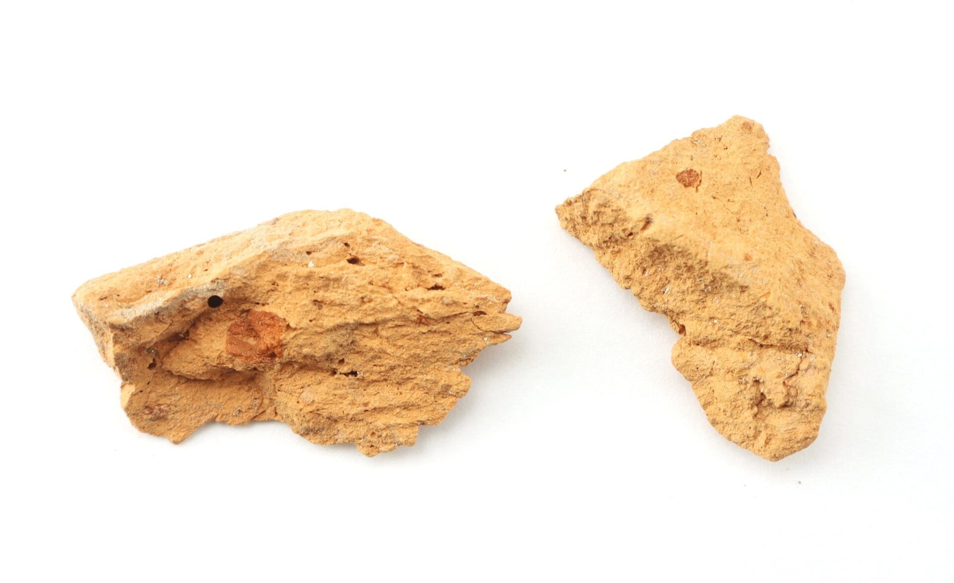 Two irregular pieces of light brown clay or earthen material—an Important Libby Prison Relic / SOLD—are displayed on a white background.