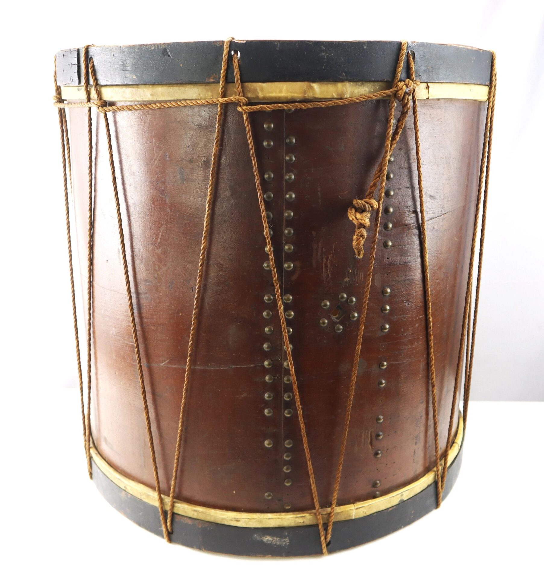 The “Galvanized Yankees” Regimental Bass Drum of the 1st U.S. Volunteers, featuring rope tensioning and brass hoops, is shown against a plain white background.