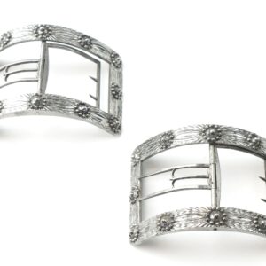 A pair of Colonial Shoe Buckles featuring decorative silver floral engravings and three-prong clasps, shown on a white background.