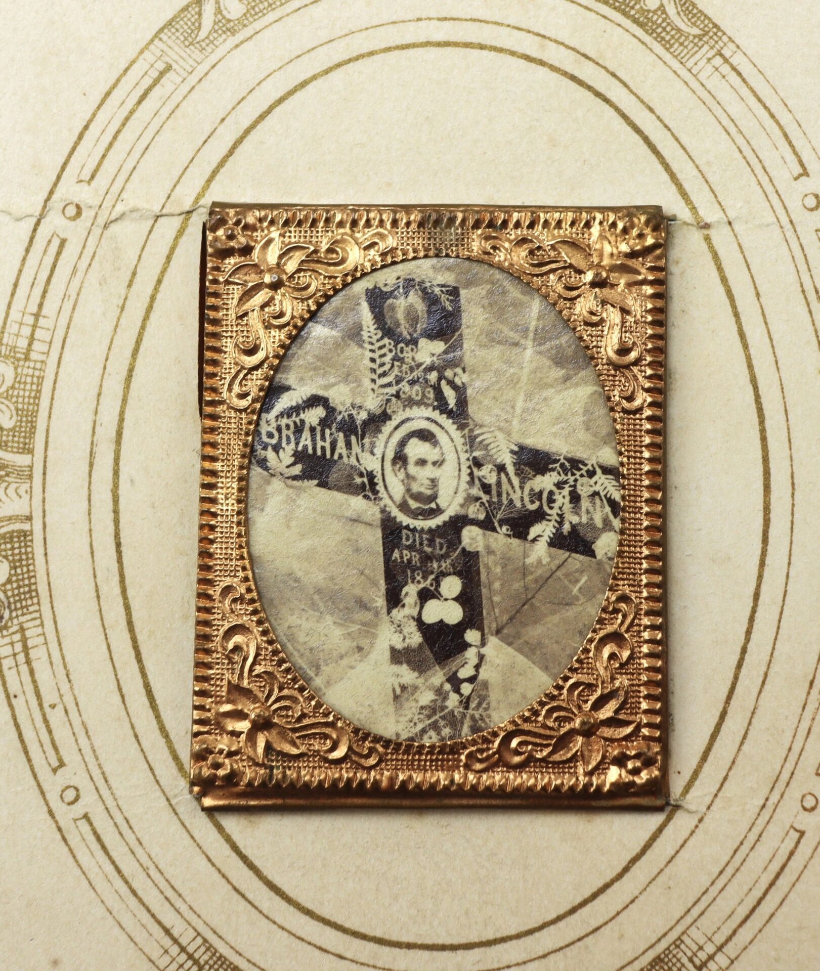The Lincoln Mourning CDV (SOLD) showcases a sepia-toned portrait of a man overlaid on a cross, set in an ornate gold frame with handwritten text and decorative patterns on a textured background.