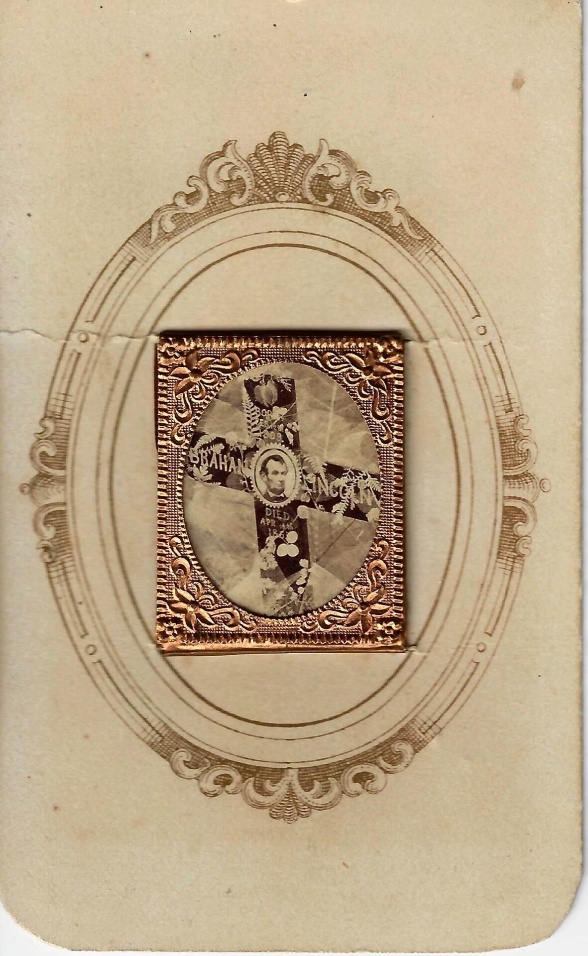 A sepia-toned Lincoln Mourning CDV featuring an embossed gold and black crest at the center, framed by an ornate oval border on aged paper.