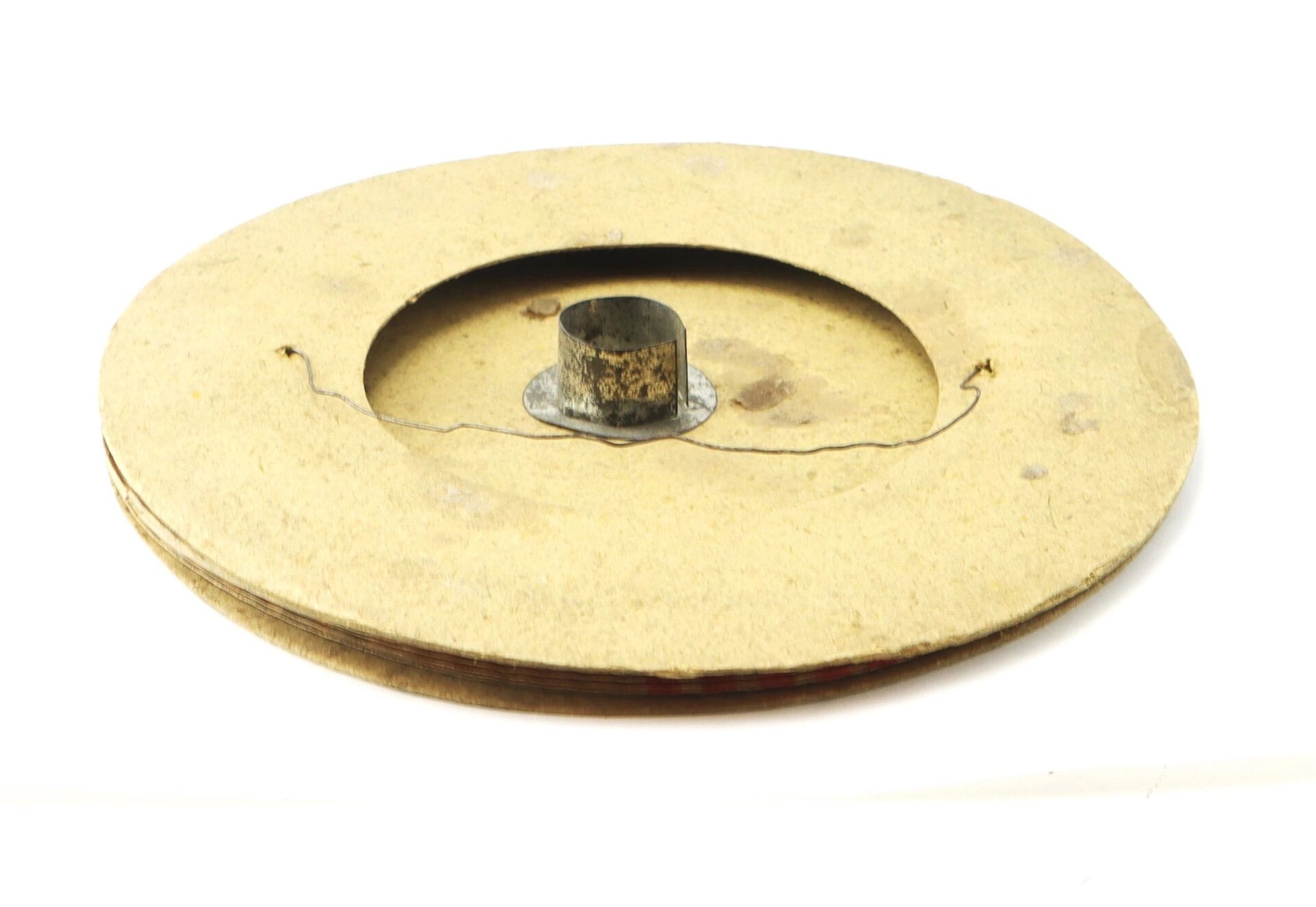 A Political Parade Lantern with a large, round design and central hub is shown with its thin wire partially unwound, set against a white background.