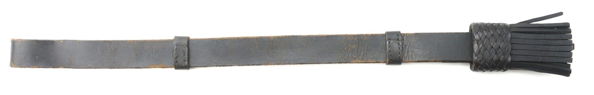The Enlisted Saber Knot – Near Mint Condition Example is a black leather accessory featuring a flat handle, braided grip, and multiple leather tassels at the end.
