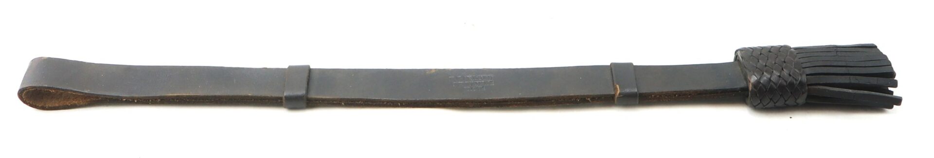 An Enlisted Saber Knot in near mint condition, featuring a looped handle and multiple leather tails, is displayed against a white background.