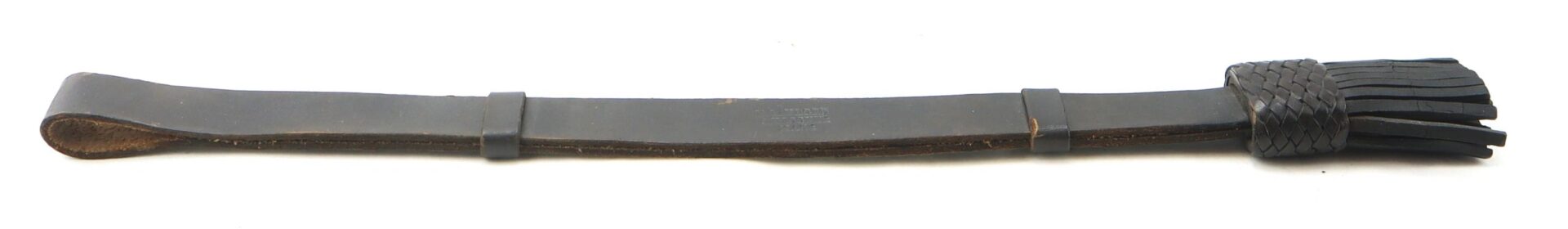 The Enlisted Saber Knot (Near Mint Condition) features a black leather braided section, a looped handle, and multiple leather strands at the end.