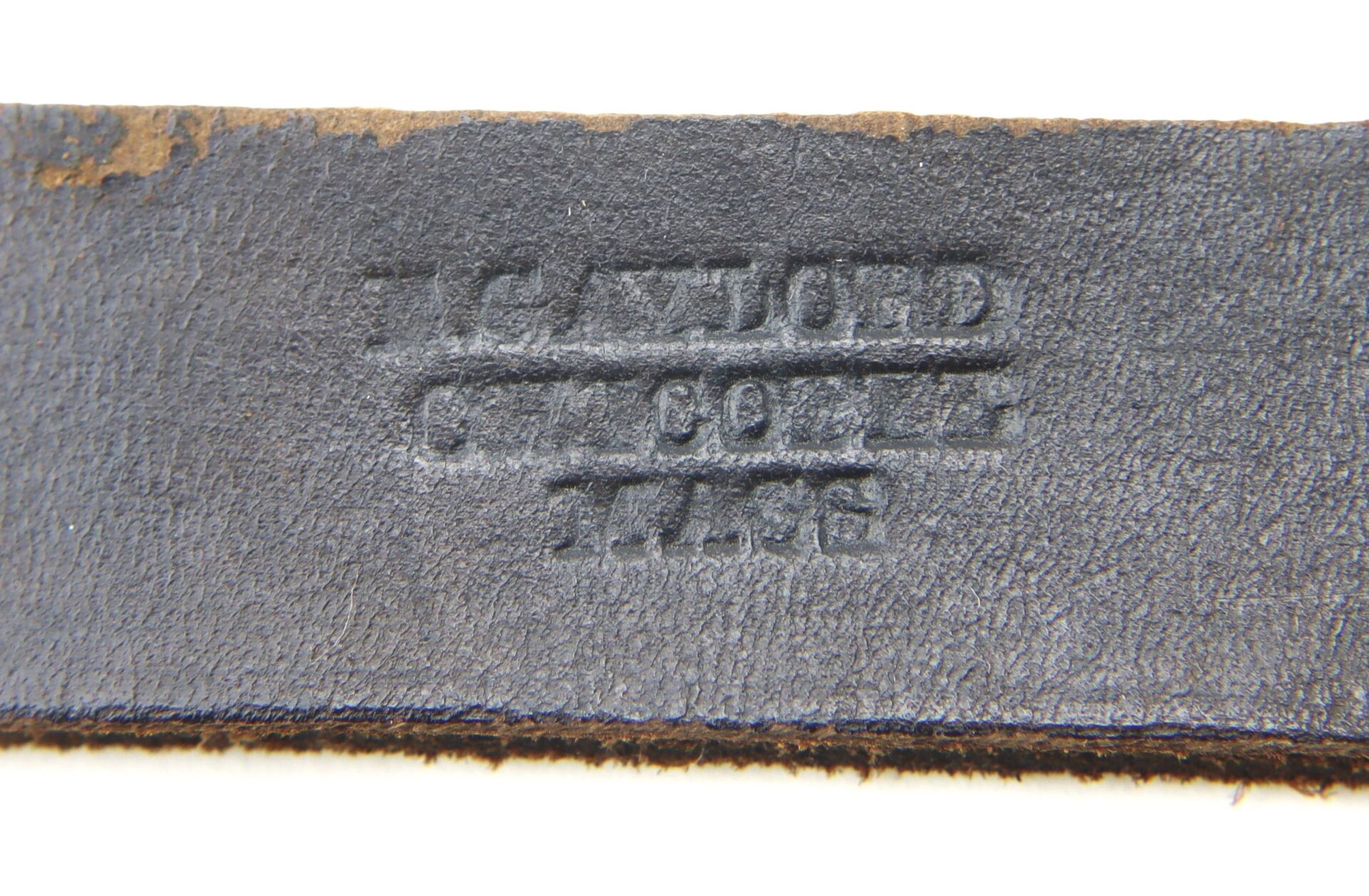 Close-up of an Enlisted Saber Knot in near mint condition, showing a black leather strap embossed with the partially legible text: "J. Gaylord, Chicopee, Mass.