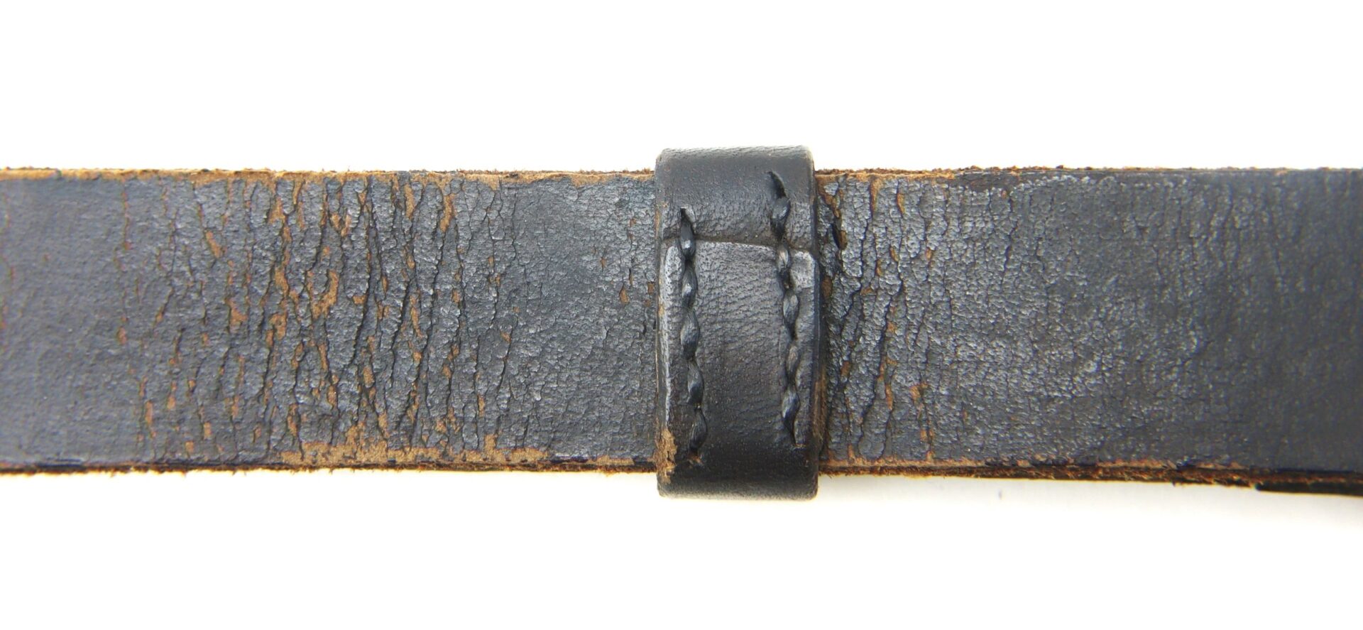A detailed view of the Enlisted Saber Knot in near mint condition, showcasing fine craftsmanship, displayed against a white background.