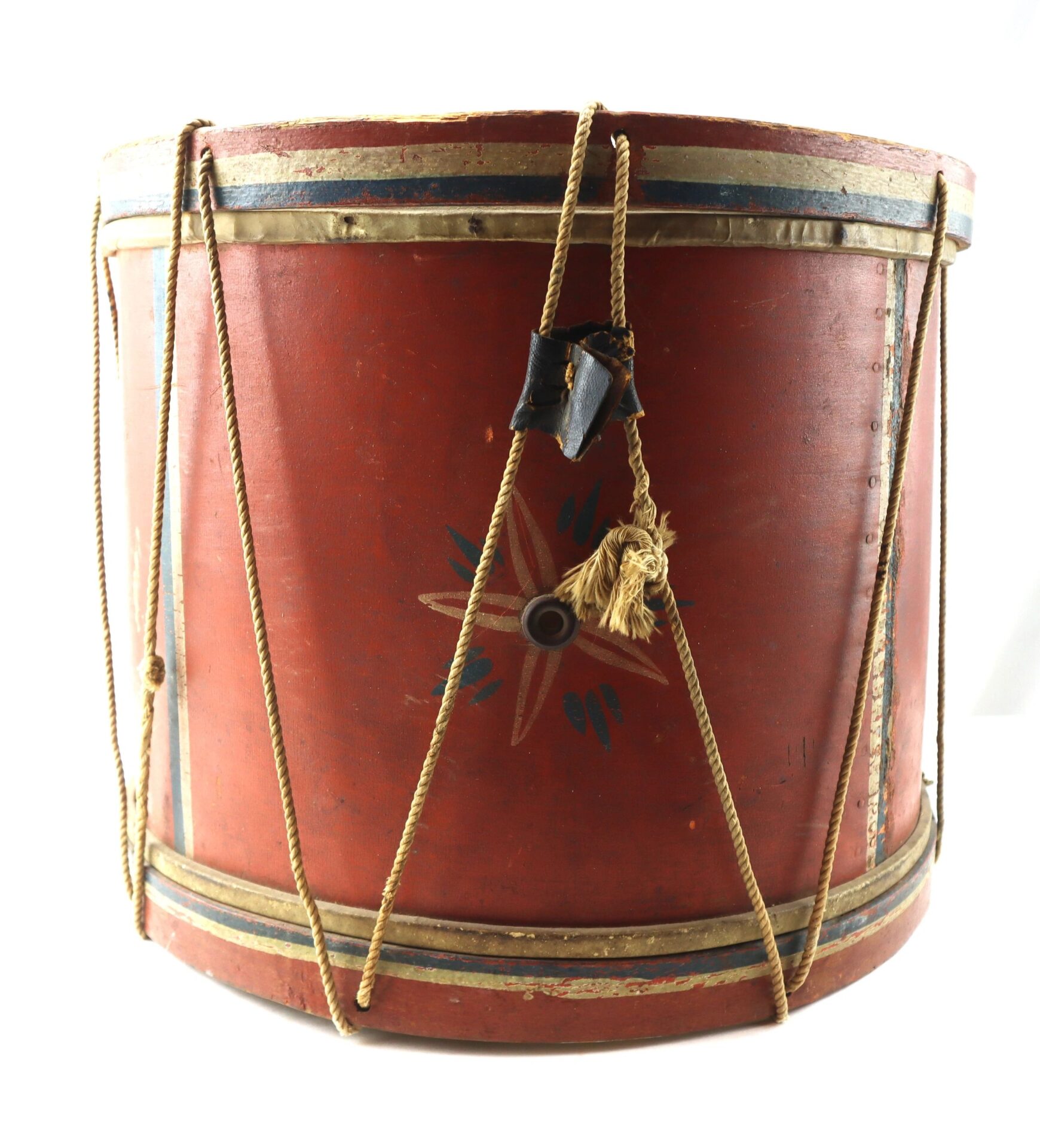 The Civil War Painted Drum features rope tensioning, a red finish with a star design, and displays visible wear on its cords and surface.