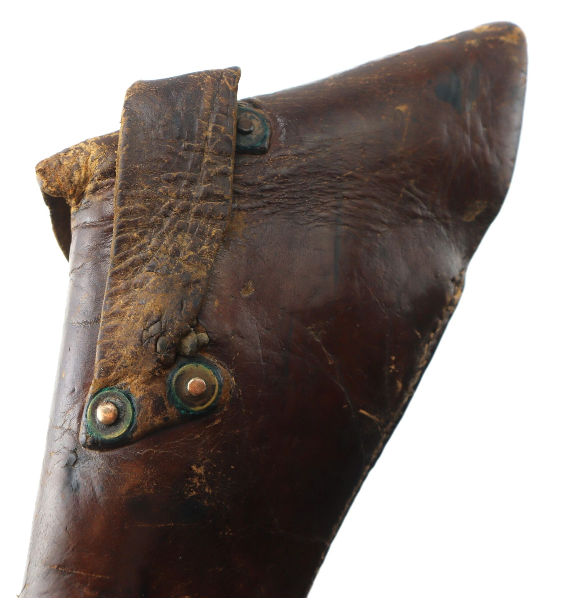 Close-up of the Wonderful “Rose of Texas” Holster: worn brown leather with visible stitching, rivets, and a textured strap across the top.