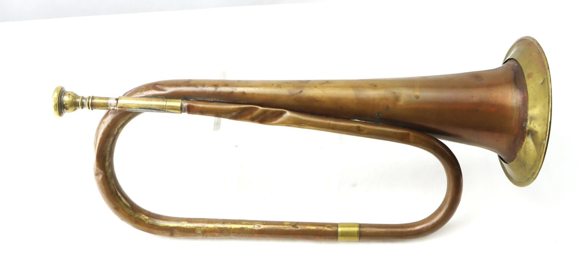 The Civil War Bugle, featuring a bent tube and flared bell, is displayed on a white surface.