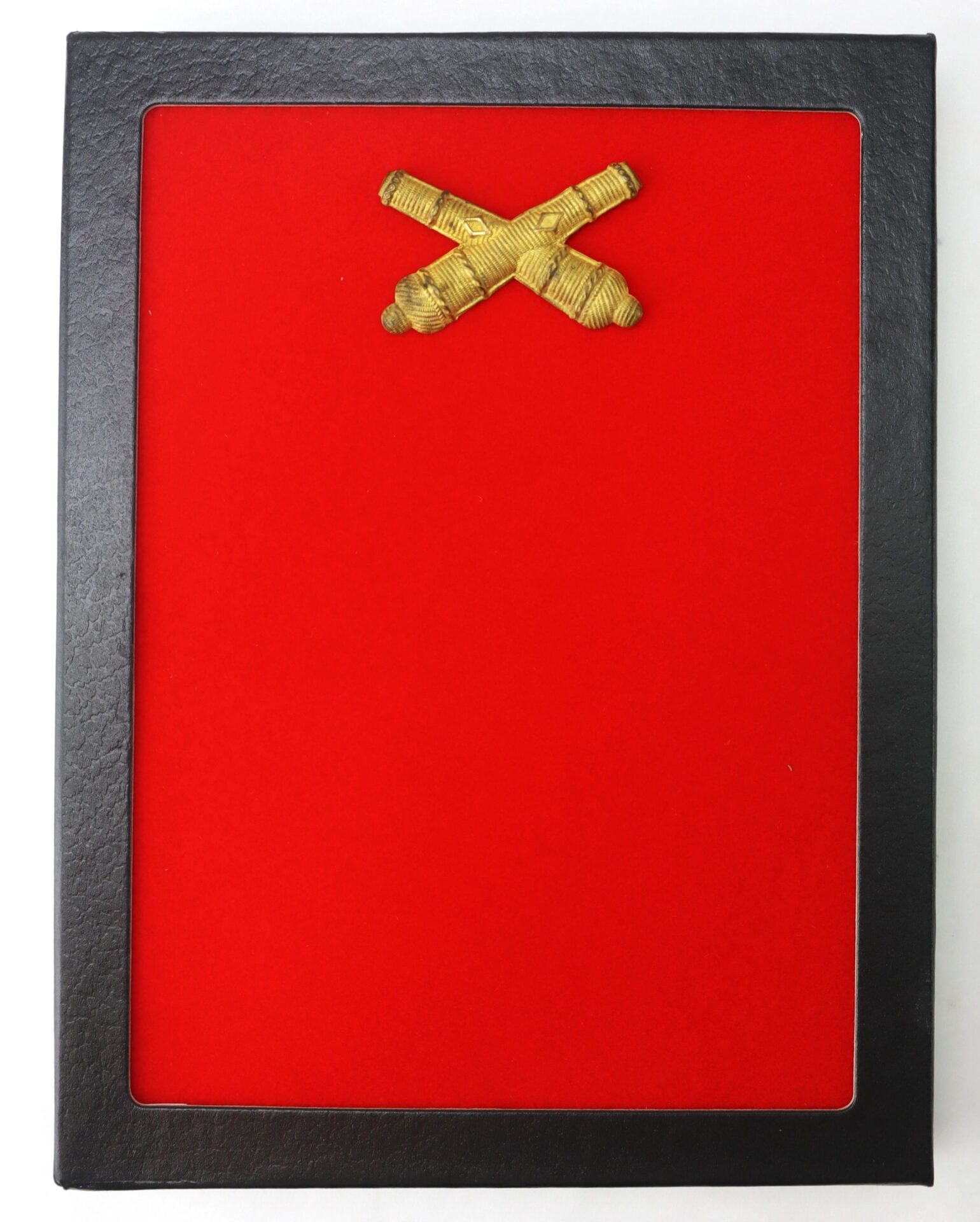 The Small Officer’s False Embroidered Cross Cannon features two gold crossed cannons on a red background, set in a black frame.