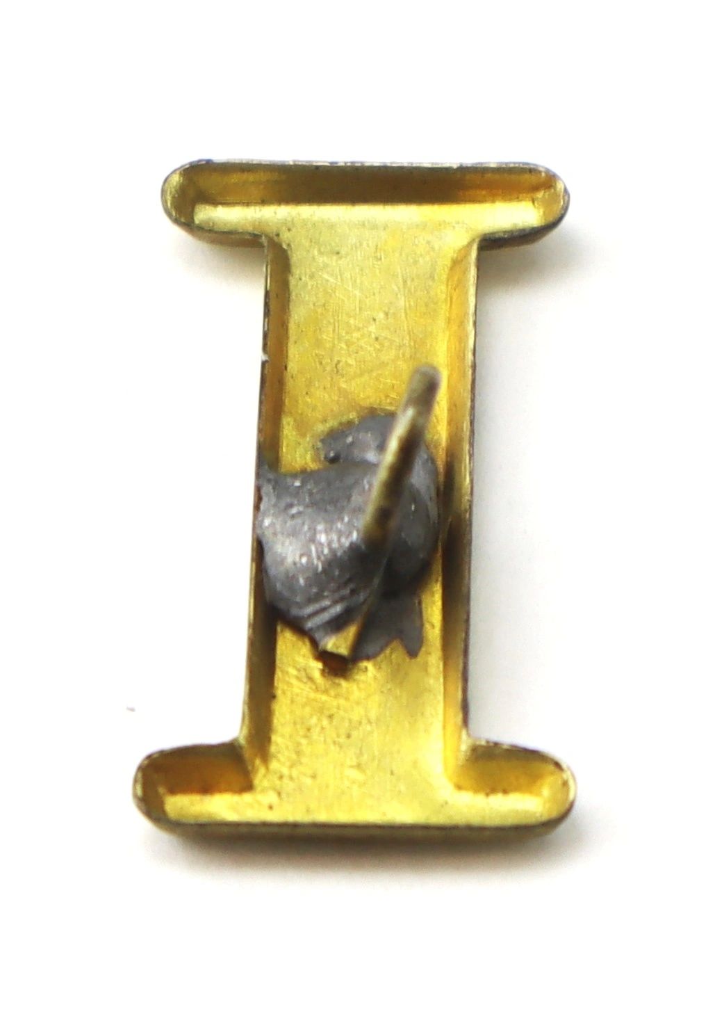 The Regimental Company Letter I is a gold metal pin with a bent fastener on the back.