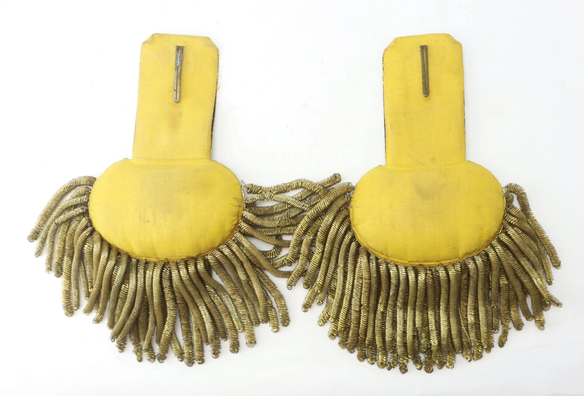 A pair of U.S. Officer’s Bullion Epaulettes, featuring thick gold fringe and a rectangular attachment strap, displayed on a white background.