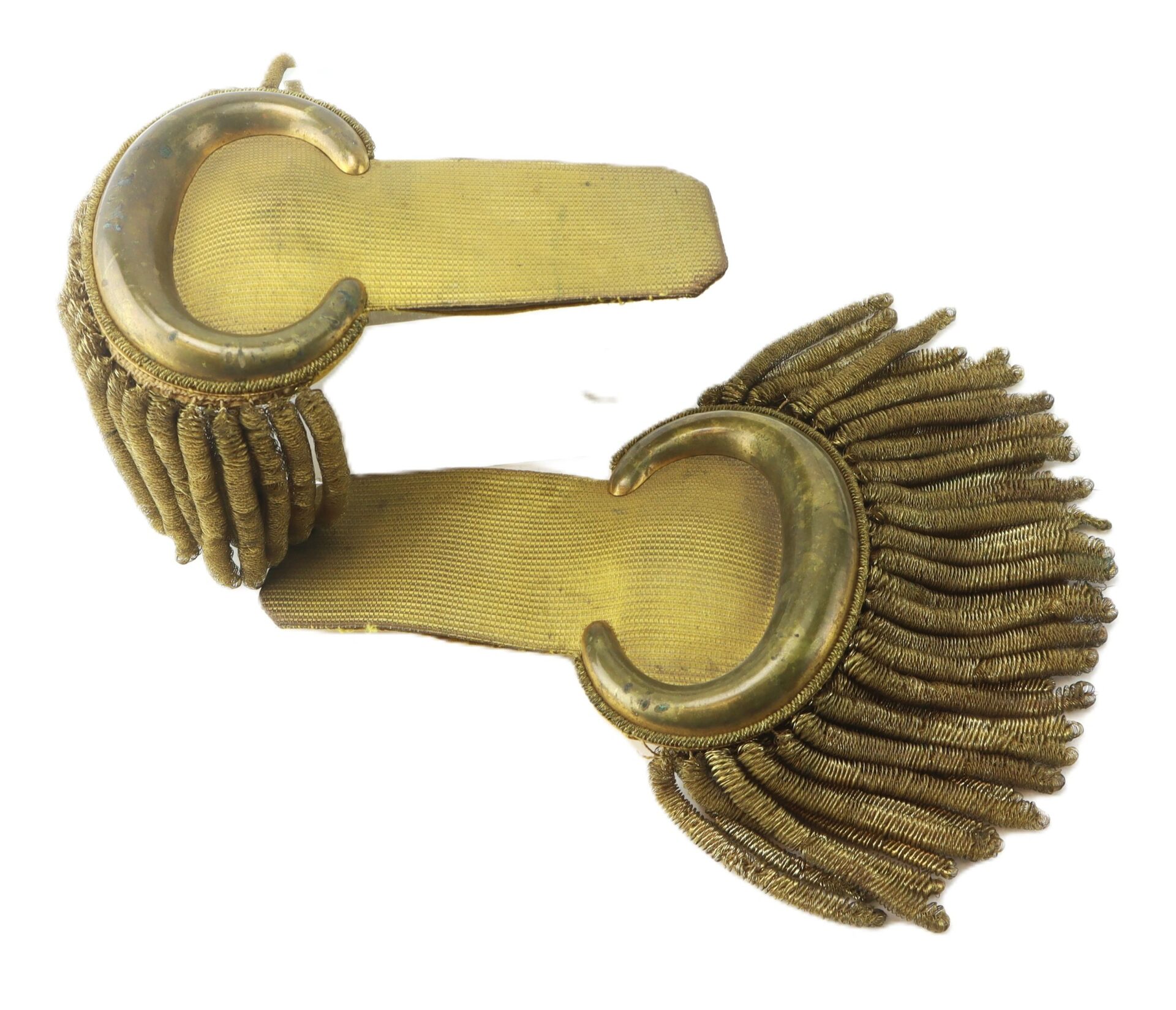 A pair of U.S. Officer’s Bullion Epaulettes featuring vintage gold fabric, fringed tassels, and curved metal ornaments.