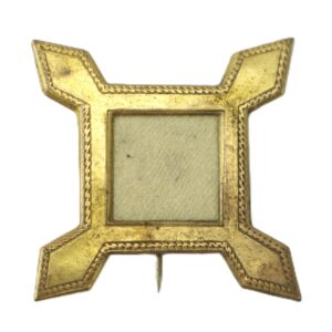 The 10th Corps Badge is a square gold frame with four protruding corners, an empty center, and a pin at the bottom.