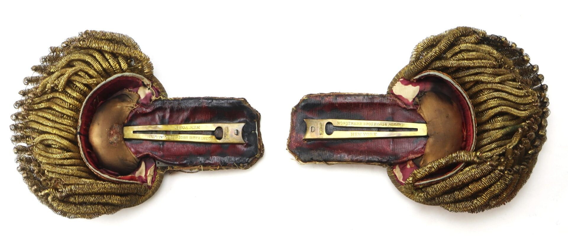 U.S. Officer’s Epaulettes featuring ornate gold design, decorative fringe, and metal nameplates, displayed on a white background.