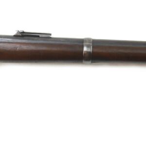 The Model 1863 Sharps Rifle U.S. Military Issue Breechloader, featuring a wooden stock, metal barrel, and sling swivel, is displayed on a white background. SOLD.