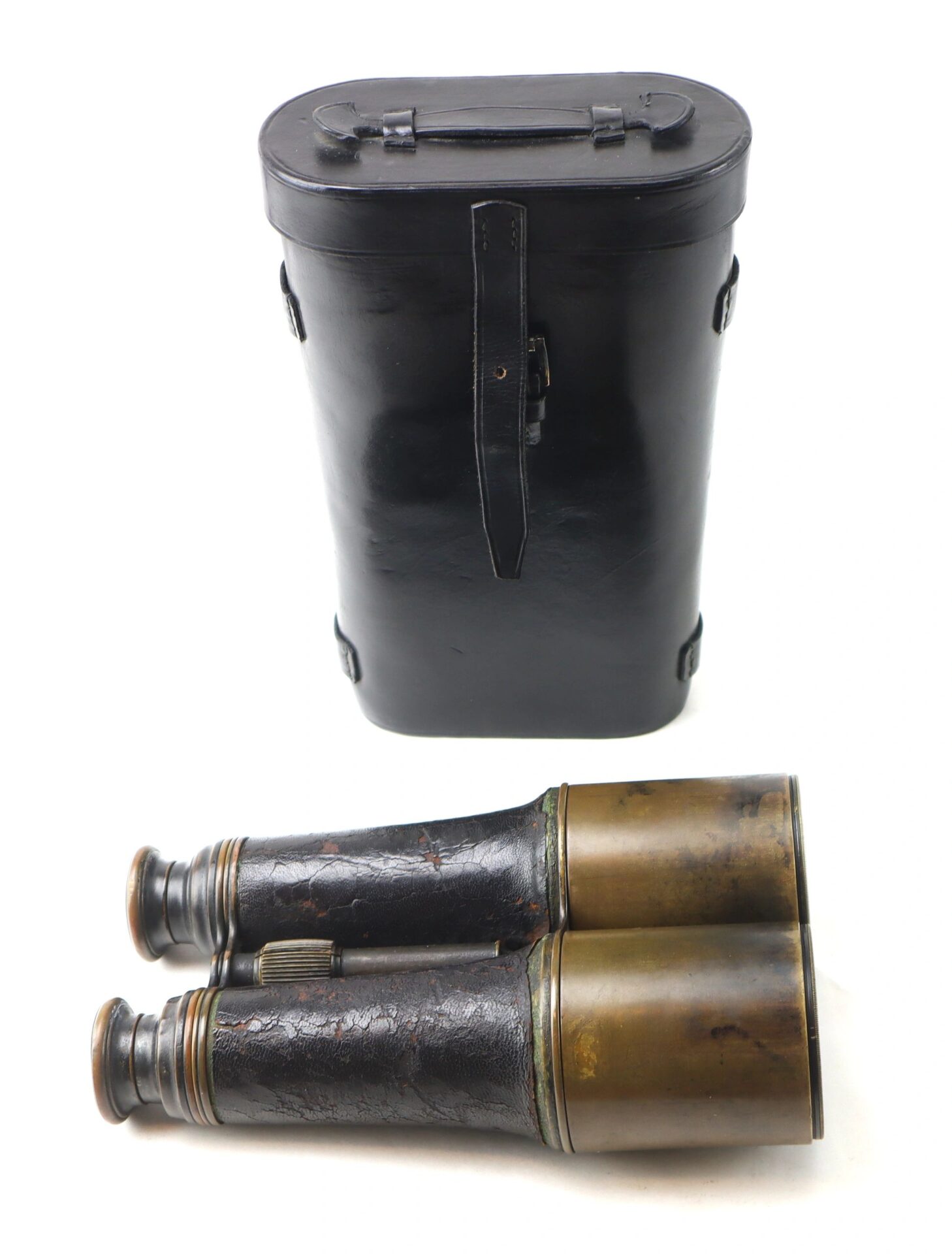 A pair of Bardou & Son Paris binoculars with a worn leather grip is displayed in front of a black leather case on a white background.