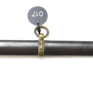 The Model 1860 Staff & Field Officer’s Sword by Schuyler, Hartley & Graham, New York features a brass hilt, black grip and knuckle guard, and comes in a dark scabbard with two hanging rings and brass fittings.