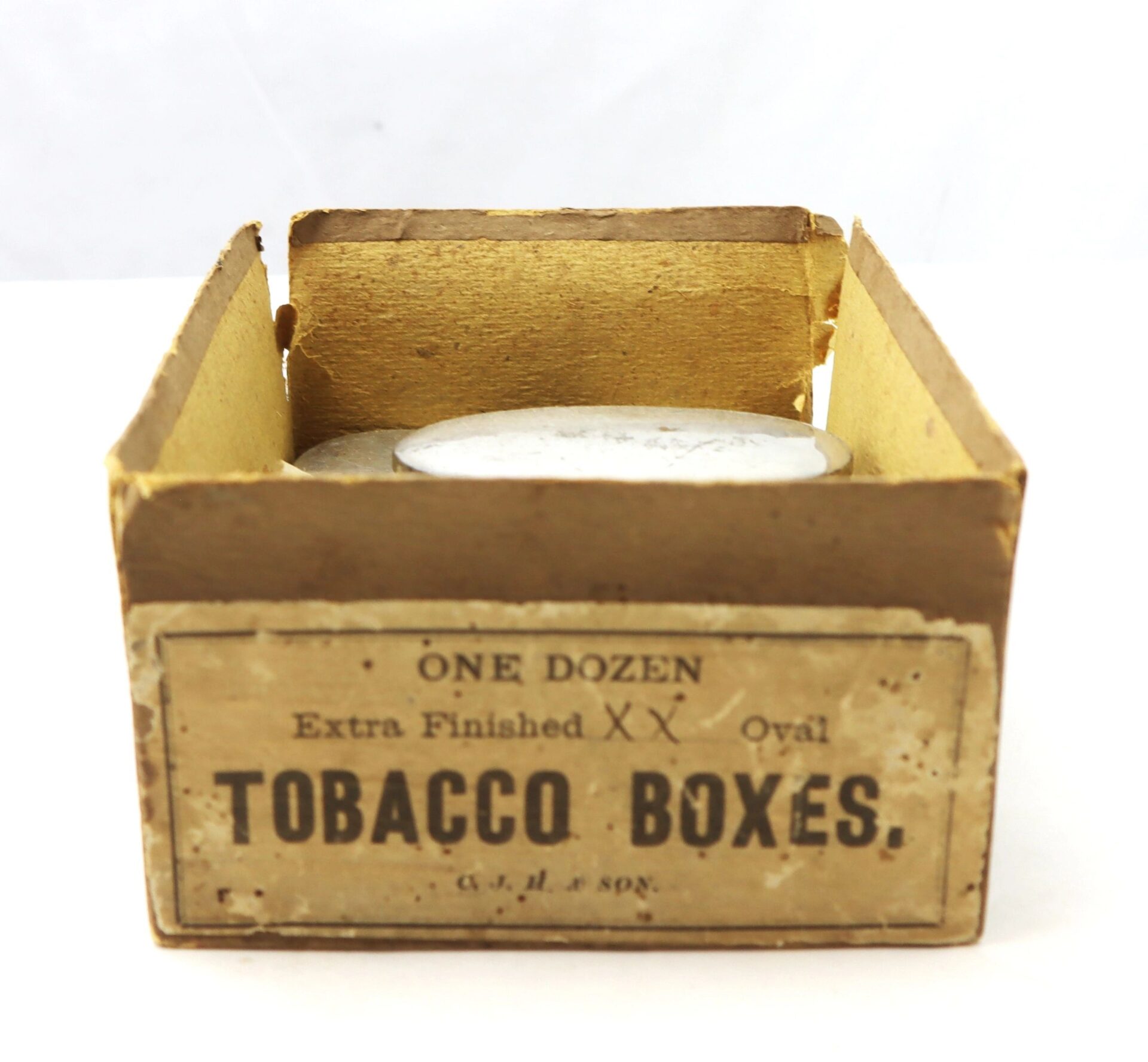 A worn, open cardboard box labeled “Boxed Set of 5 Parker Patent Tobacco Snuff Boxes – New Old Stock” with the snuff boxes inside.