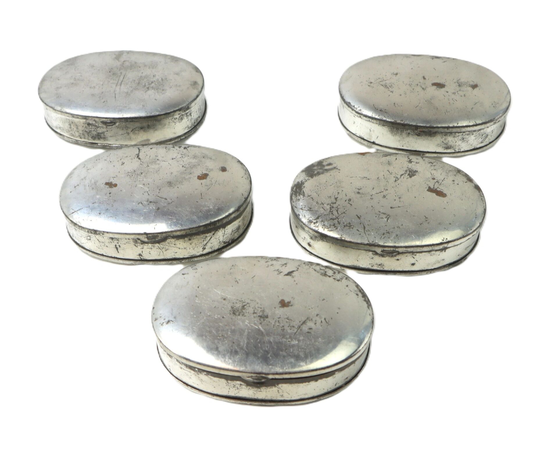 A Boxed Set of 5 Parker Patent Tobacco Snuff Boxes—“New Old Stock” in Original Box—features round, silver-colored containers with lids, arranged in a semi-circle and showing some wear and tarnish.