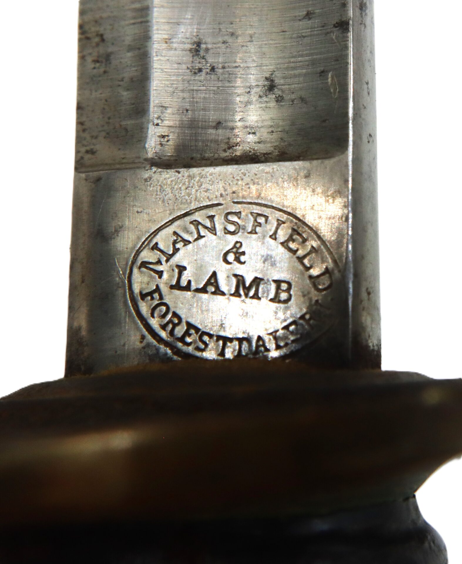 Close-up of a metal blade stamped with the oval-shaped mark "MANSFIELD & LAMB FORESTDALE.